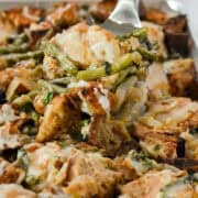 Lifting up French Onion Chicken out of the sheet pan