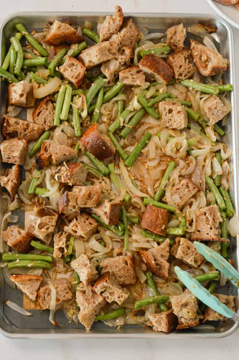 Cut up sourdough and green beans on a sheet pan