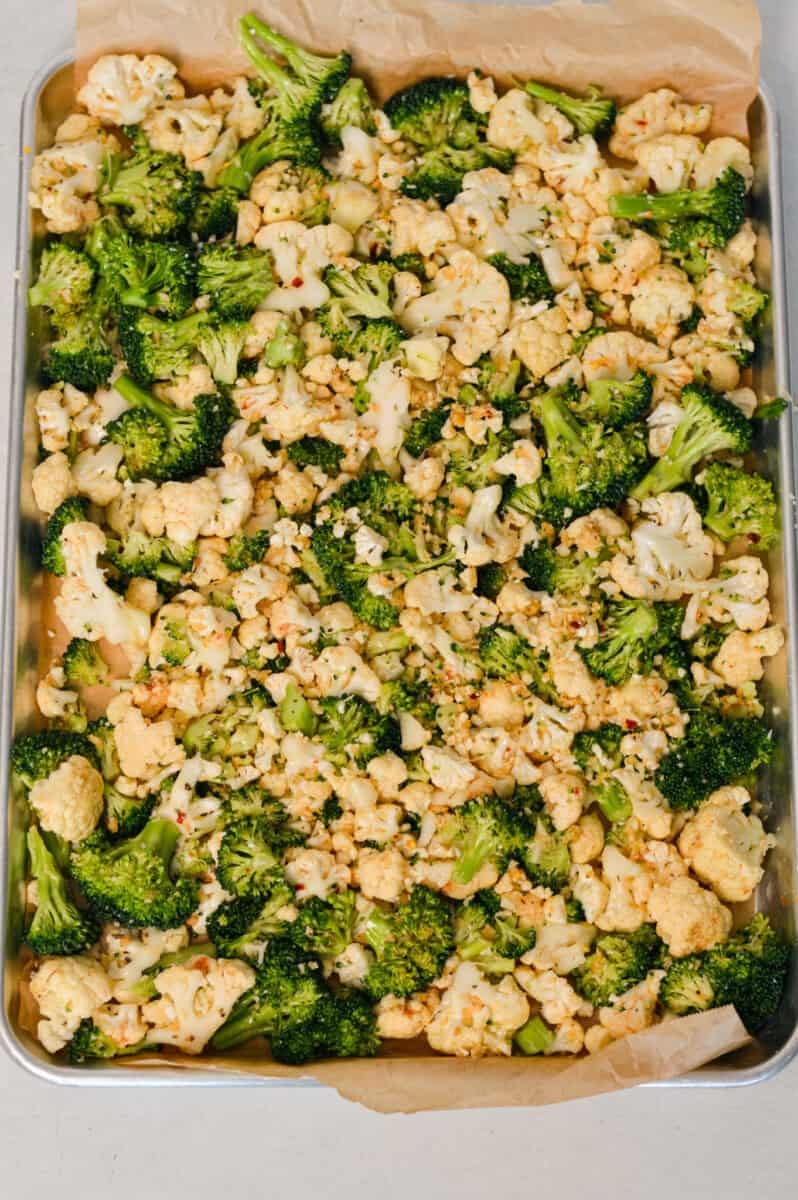 Broccoli and cauliflower spread on a large baking sheet