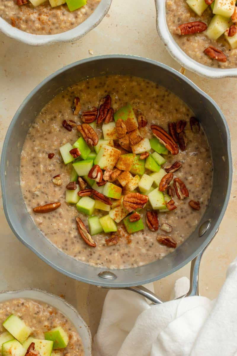 Apple and pecans added to a pot