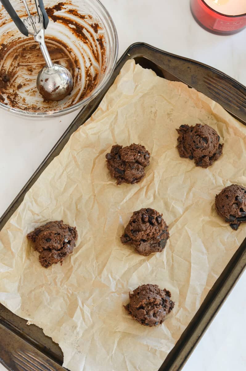 Cookie batter scooped onto a baking sheet