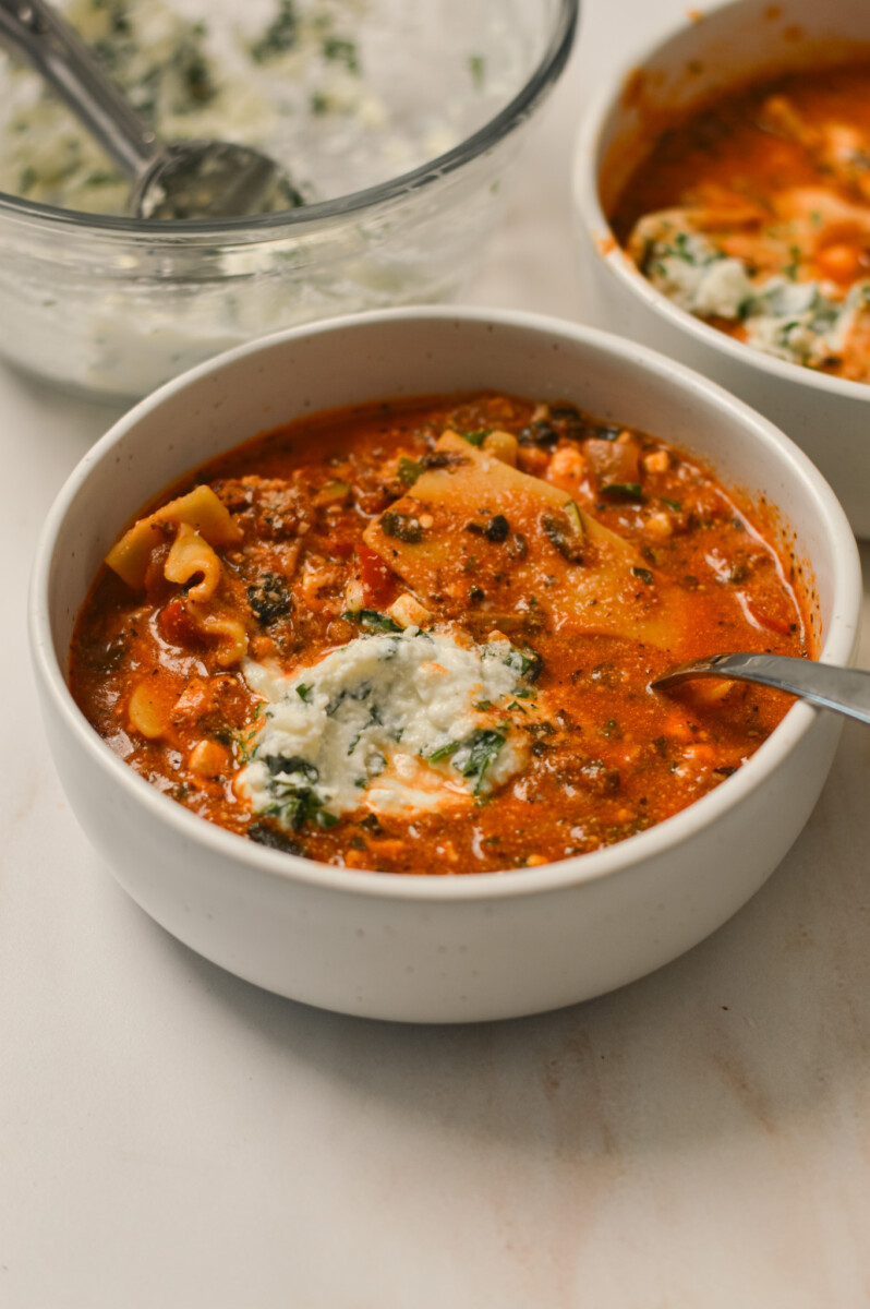 Lasagna soup in a bowl with ricotta topping