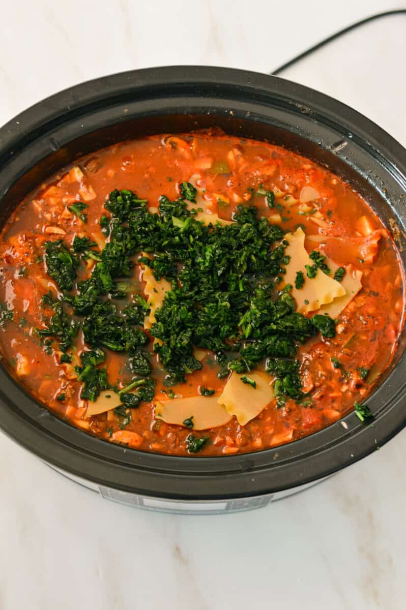 Birdseye of lasagna sheets and frozen spinach added to the slow cooker