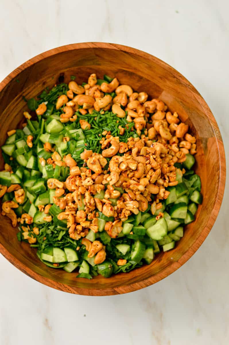Ingredients for green goddess salad combined in a large bowl