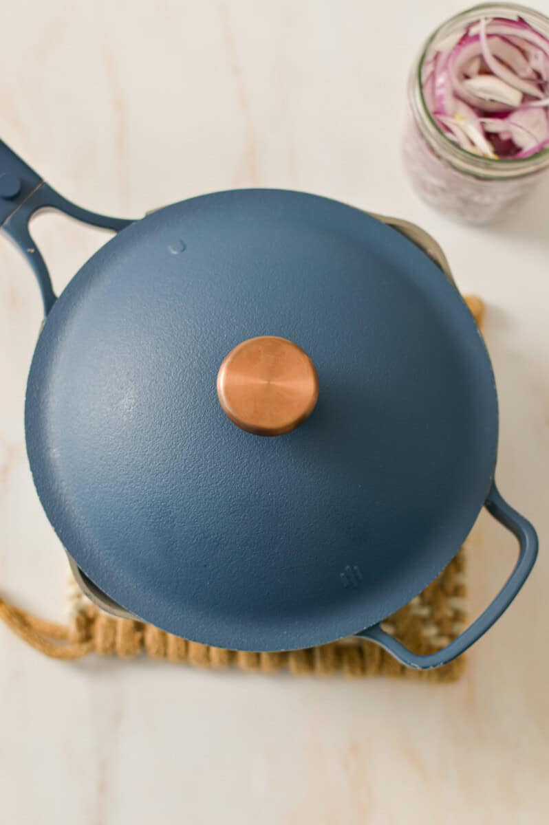 Pot with the lid on containing vinegar, water and salt