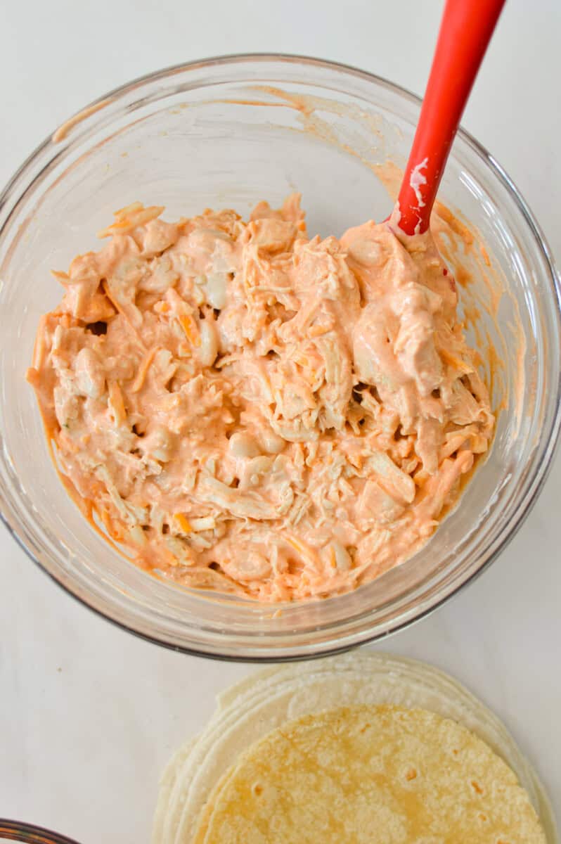 Chicken and white beans added to the bowl