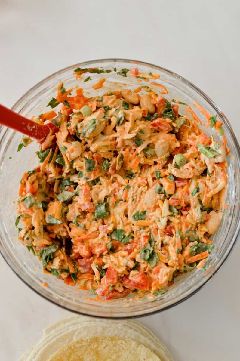 Veggies mixed in with the chicken and bean mixture