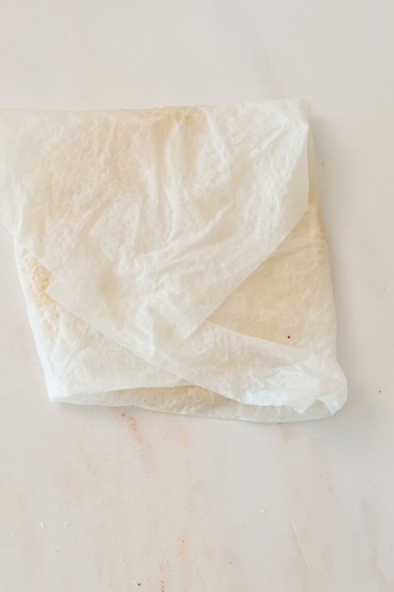 Tortillas wrapped in a damp paper towel