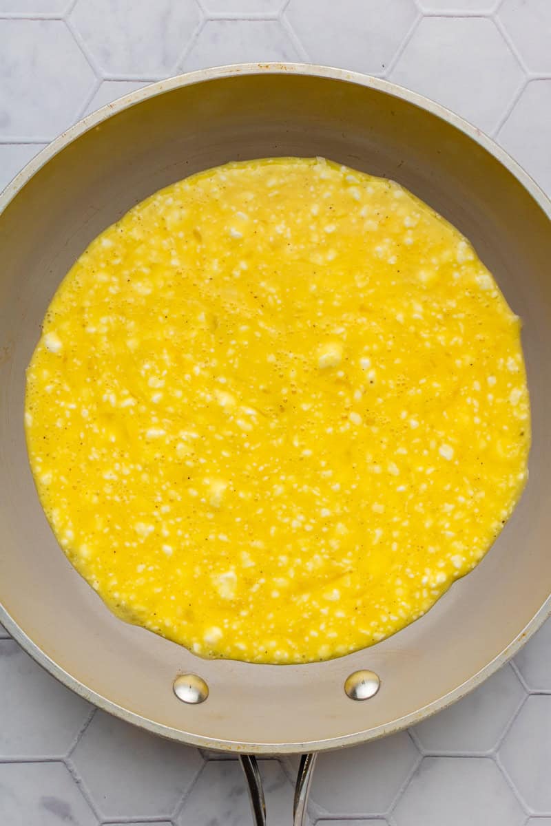 Egg mixture added to a pan.
