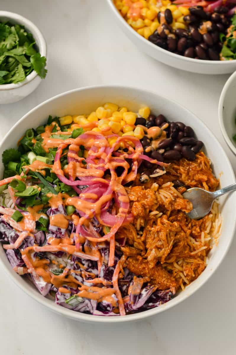 Pulled pork bowls assembled in a bowl.