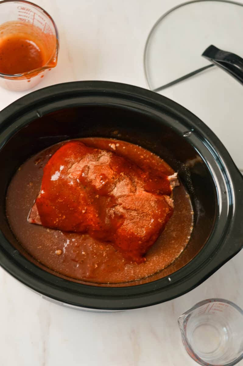 Pork roast in the crockpot with spices.