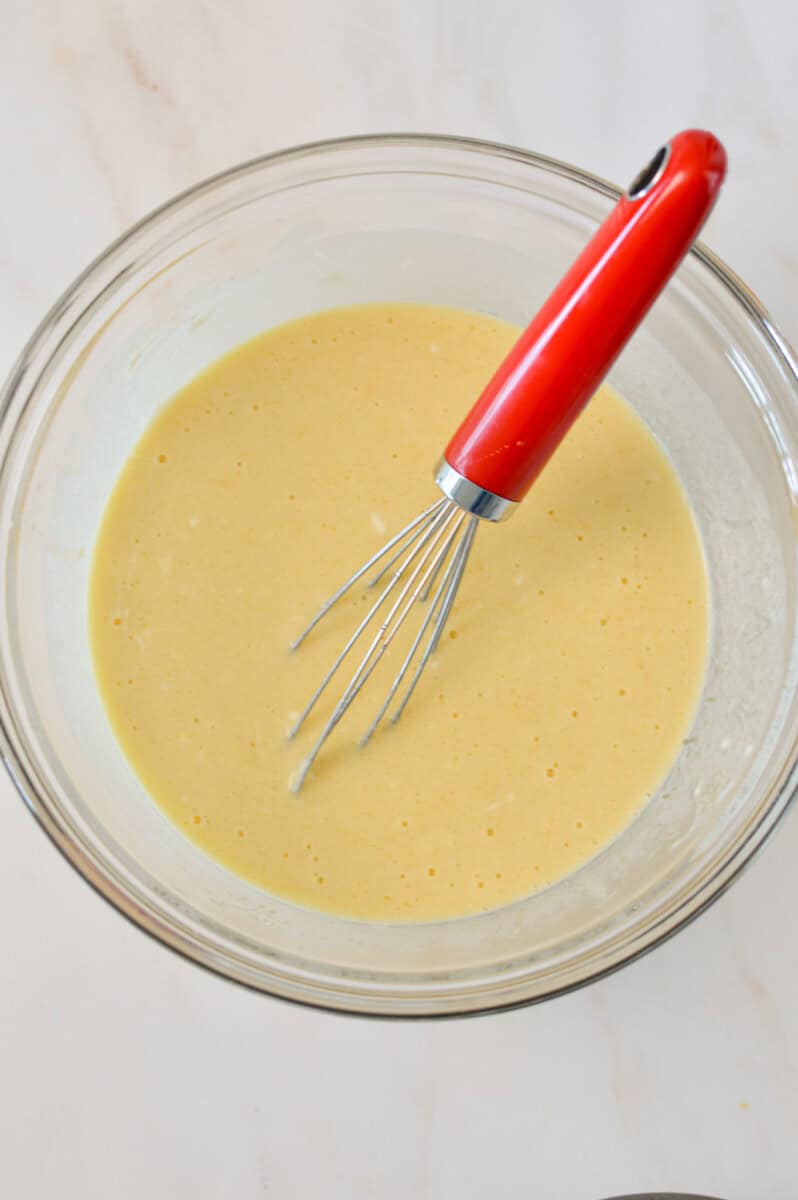 Wet ingredients combined in a mixing bowl.