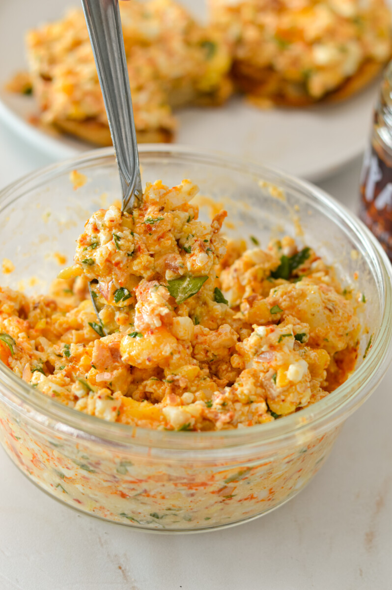 Cottage cheese egg salad in a container with a fork.