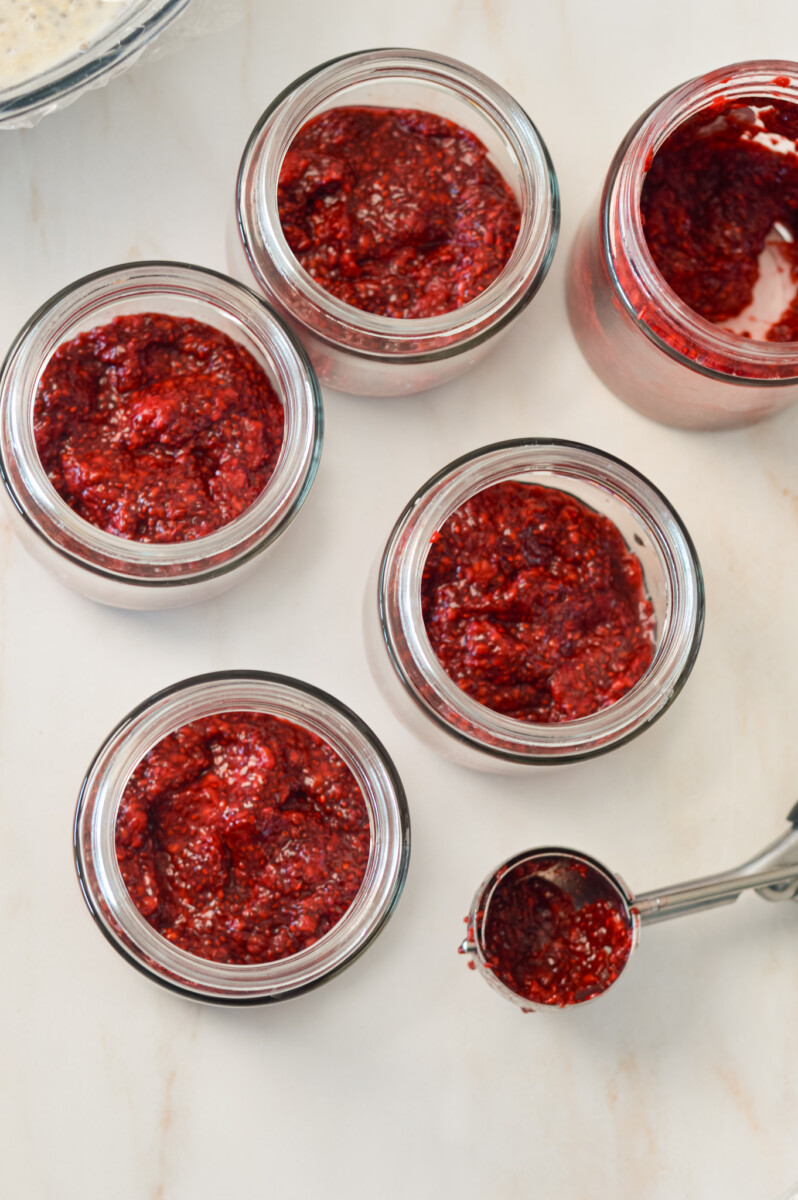Raspberry chia jam split into jars.