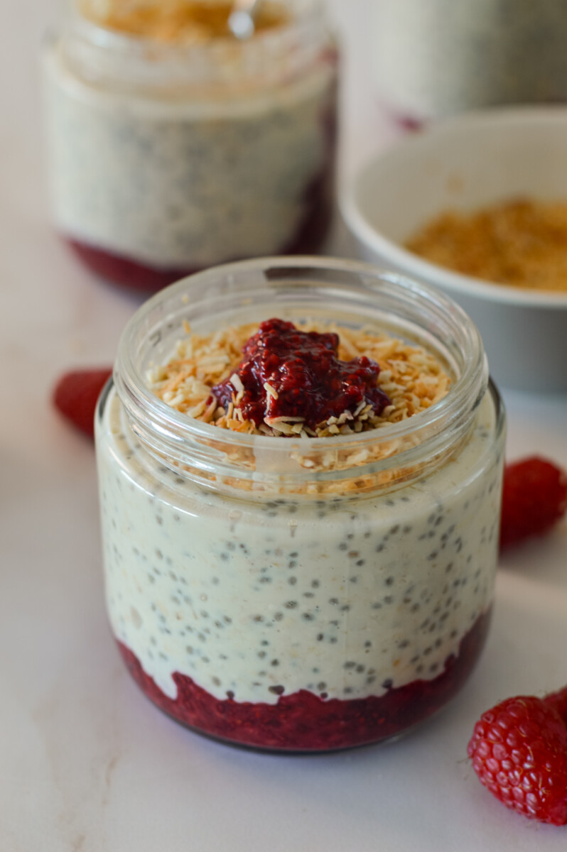 Raspberry chia jam overnight oats in a jar.