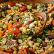 Spoon lifting up a scoop of high fiber taverna salad.