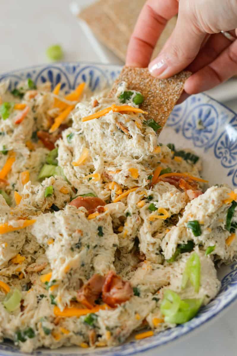 Cracker scooping up a bite of the bacon ranch chicken salad.