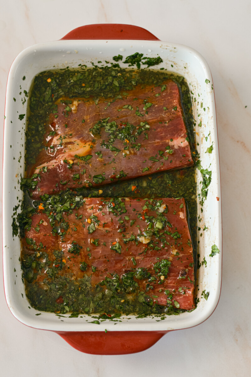 Carne asada marinade in a dish with the flank steak.