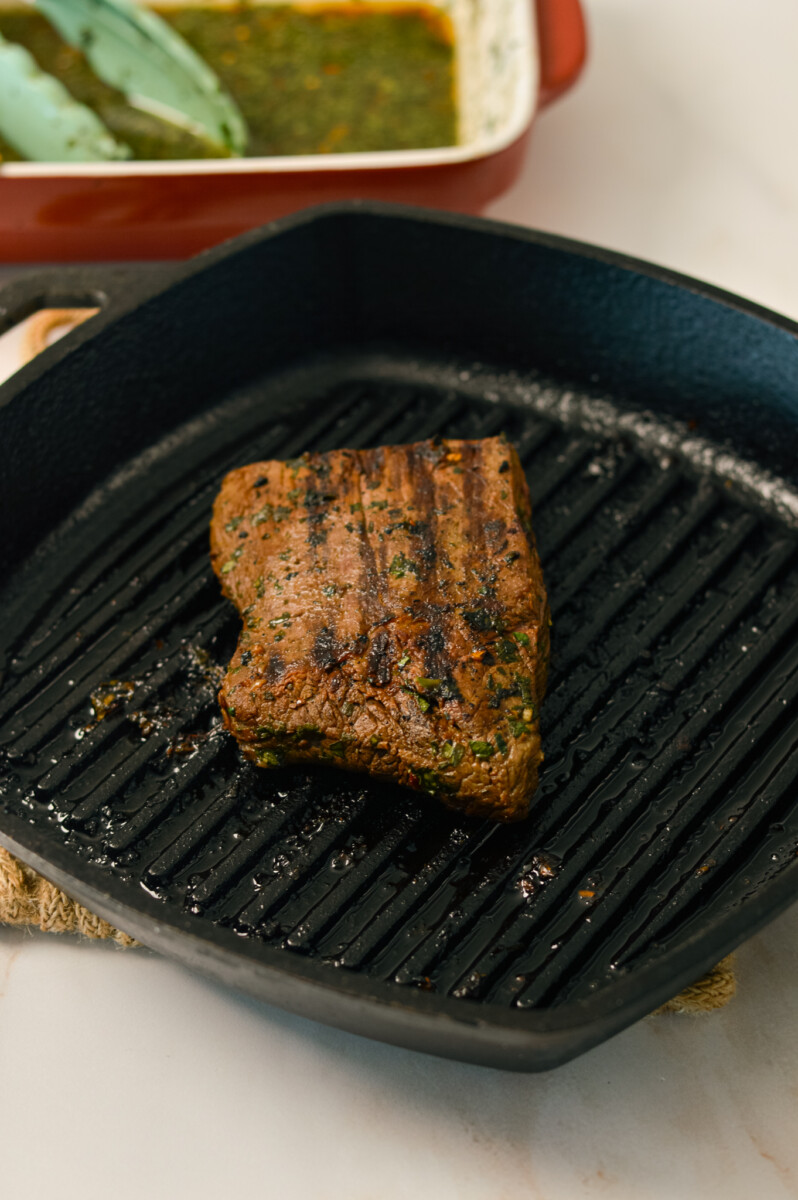 Steak on a grill.
