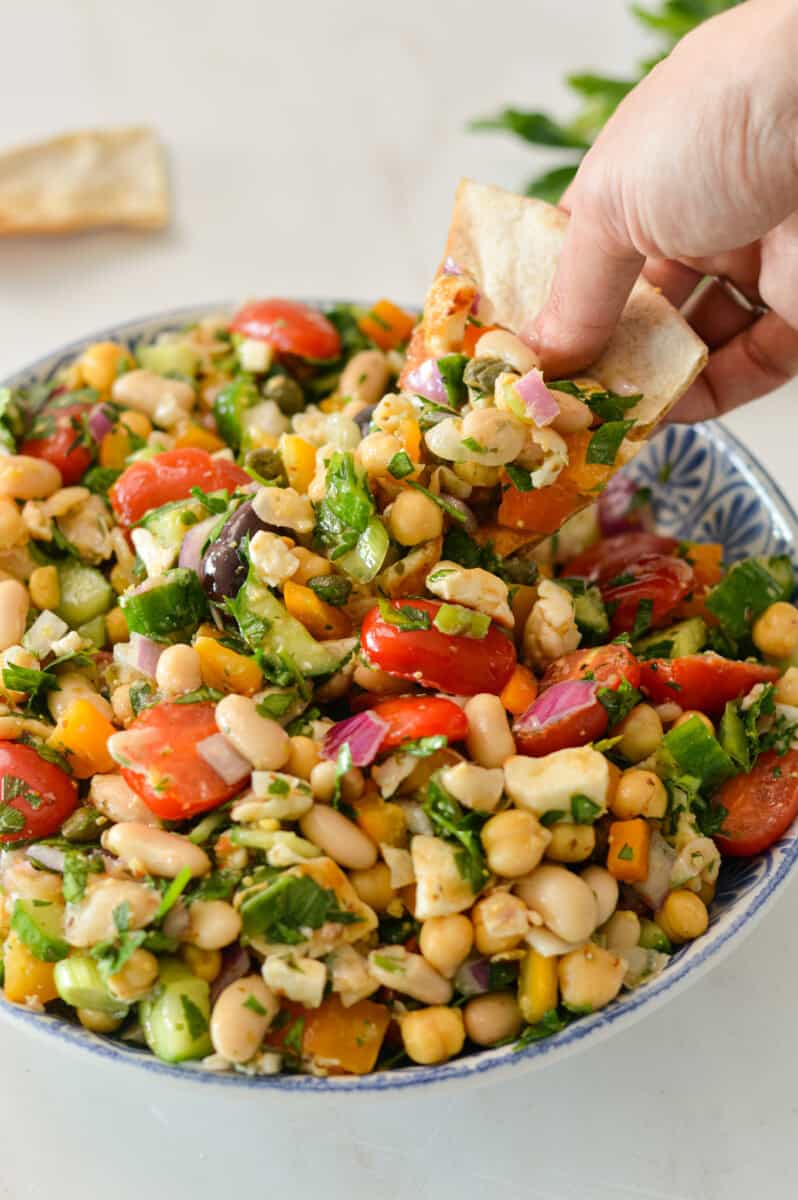 Pita scooping up taverna salad.