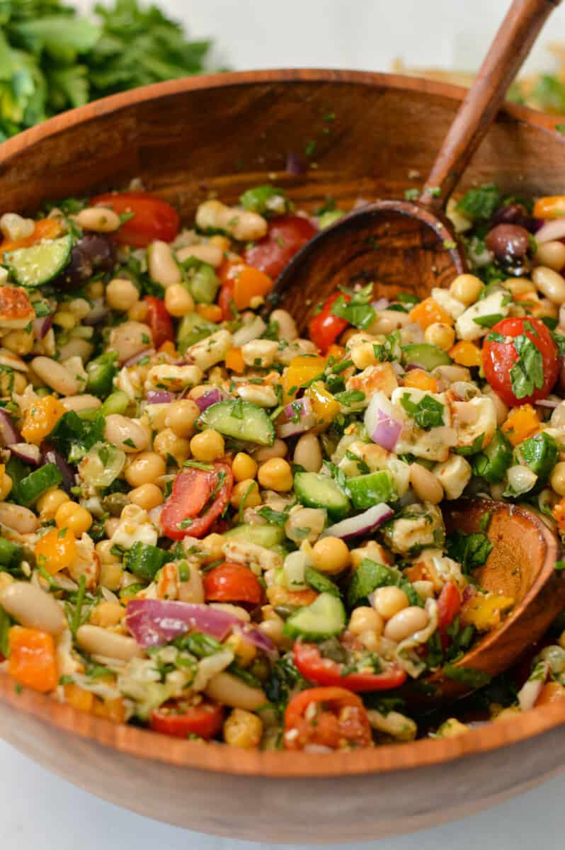 Salad tossed in a large serving bowl.
