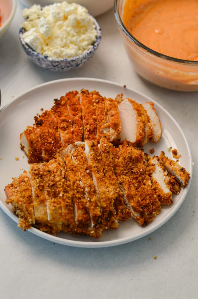Sliced crispy chicken on a plate.