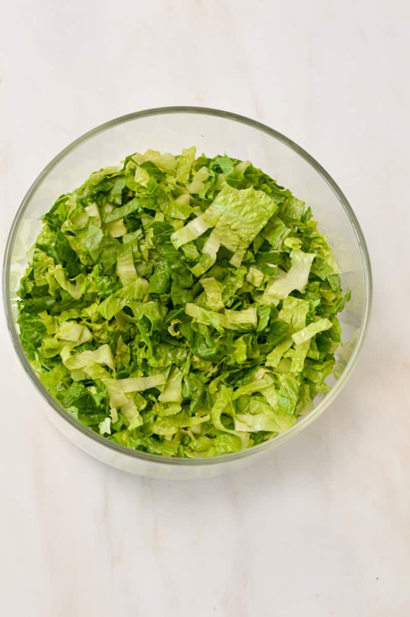Chopped lettuce in a salad bowl.