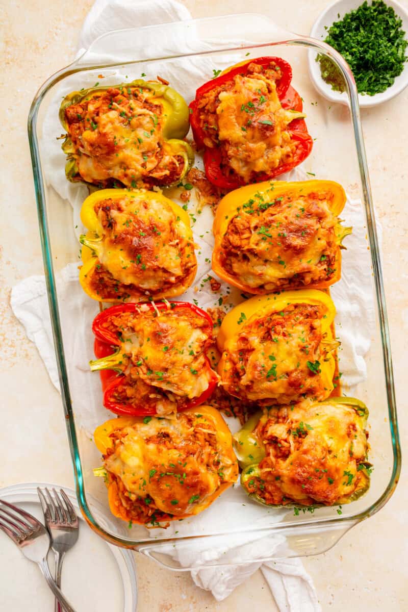 Ground turkey stuffed peppers in a baking dish.