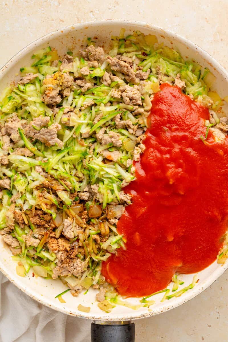 Tomato sauce and balsamic vinegar added to the ground turkey and zucchini mixture.