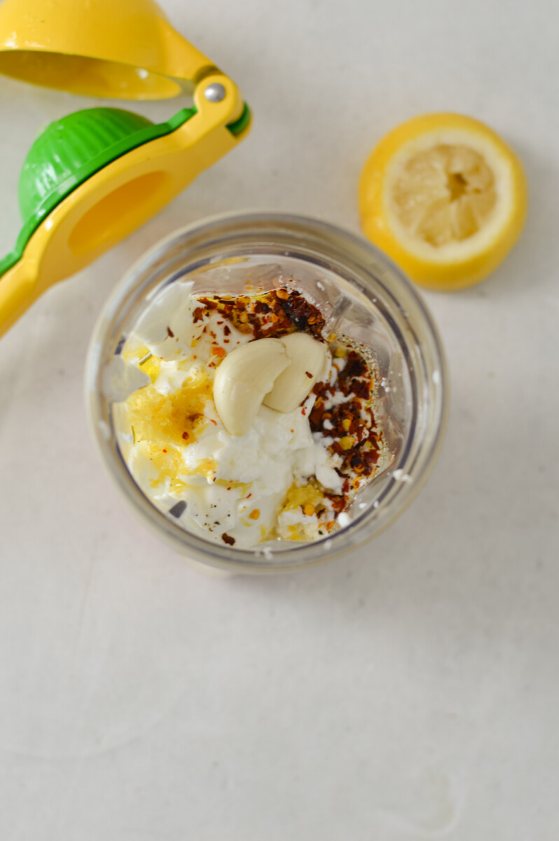 Birdseye of ingredients added to a blender.