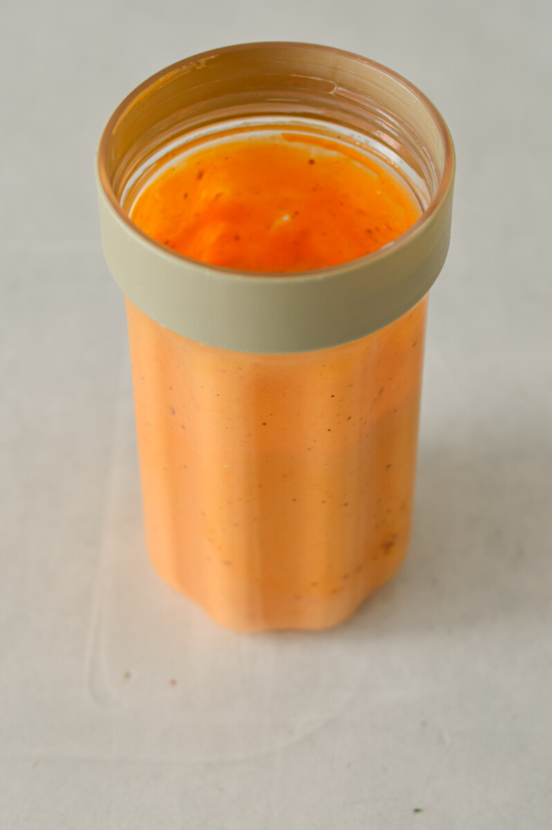 Red pepper feta dip blended in a small blender.