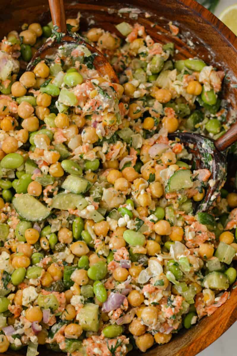 Tossed smoked salmon salad in a large salad bowl.