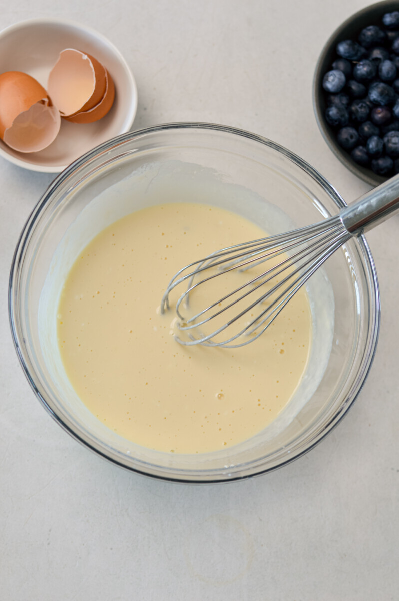 Wet ingredients whisked together in a mixing bowl.