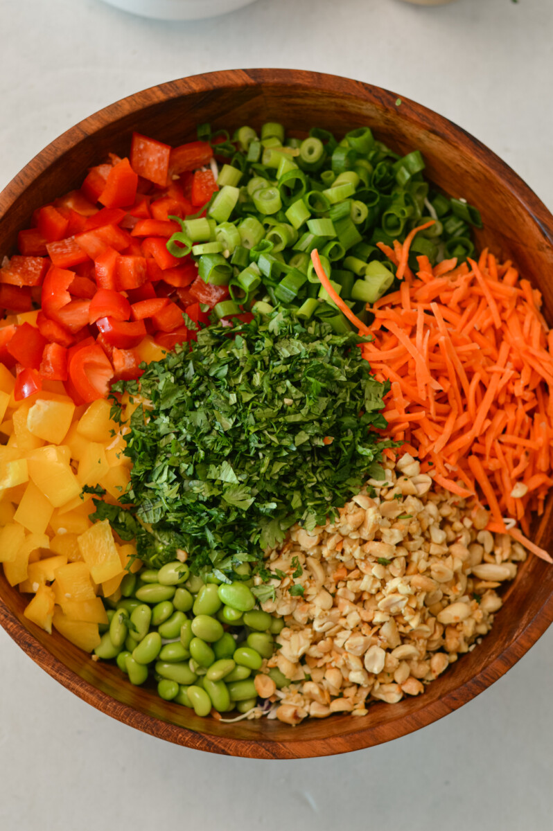 All the ingredients for the peanut salad added to a large bowl.