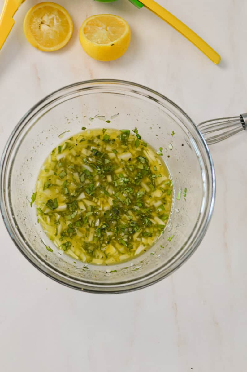 Dressing whisked in a bowl.