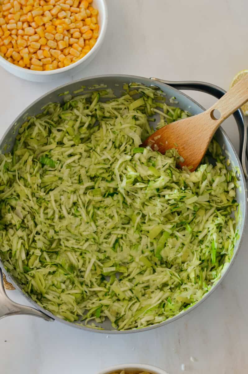 Shredded zucchini in a pan.