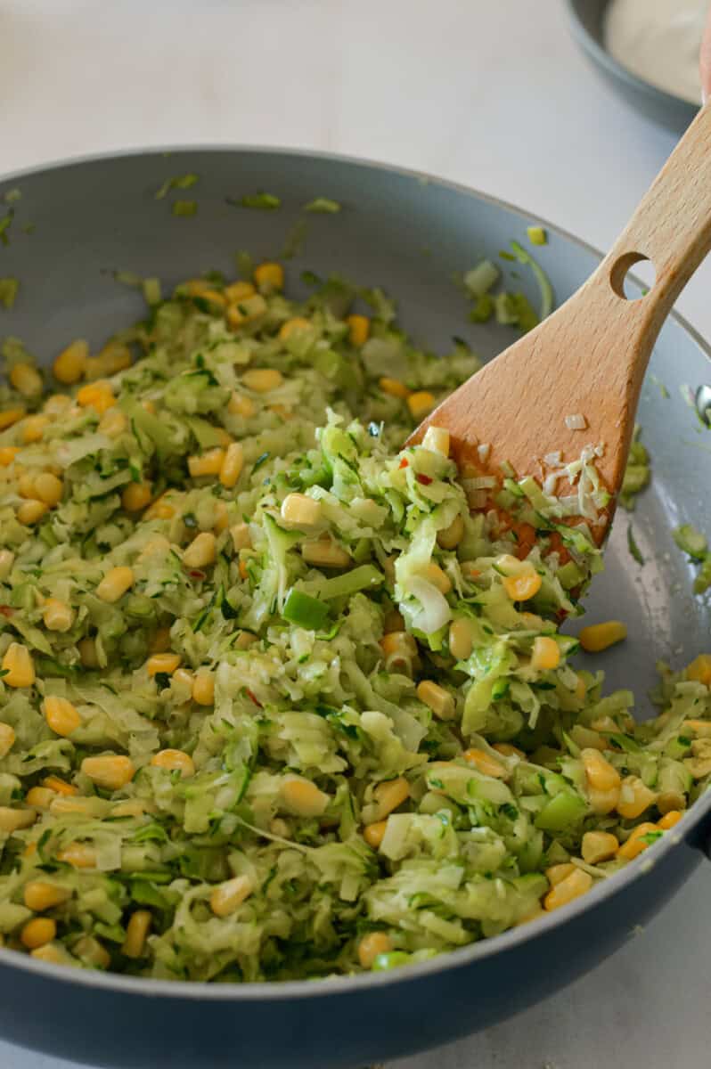 Corn added to the pan.