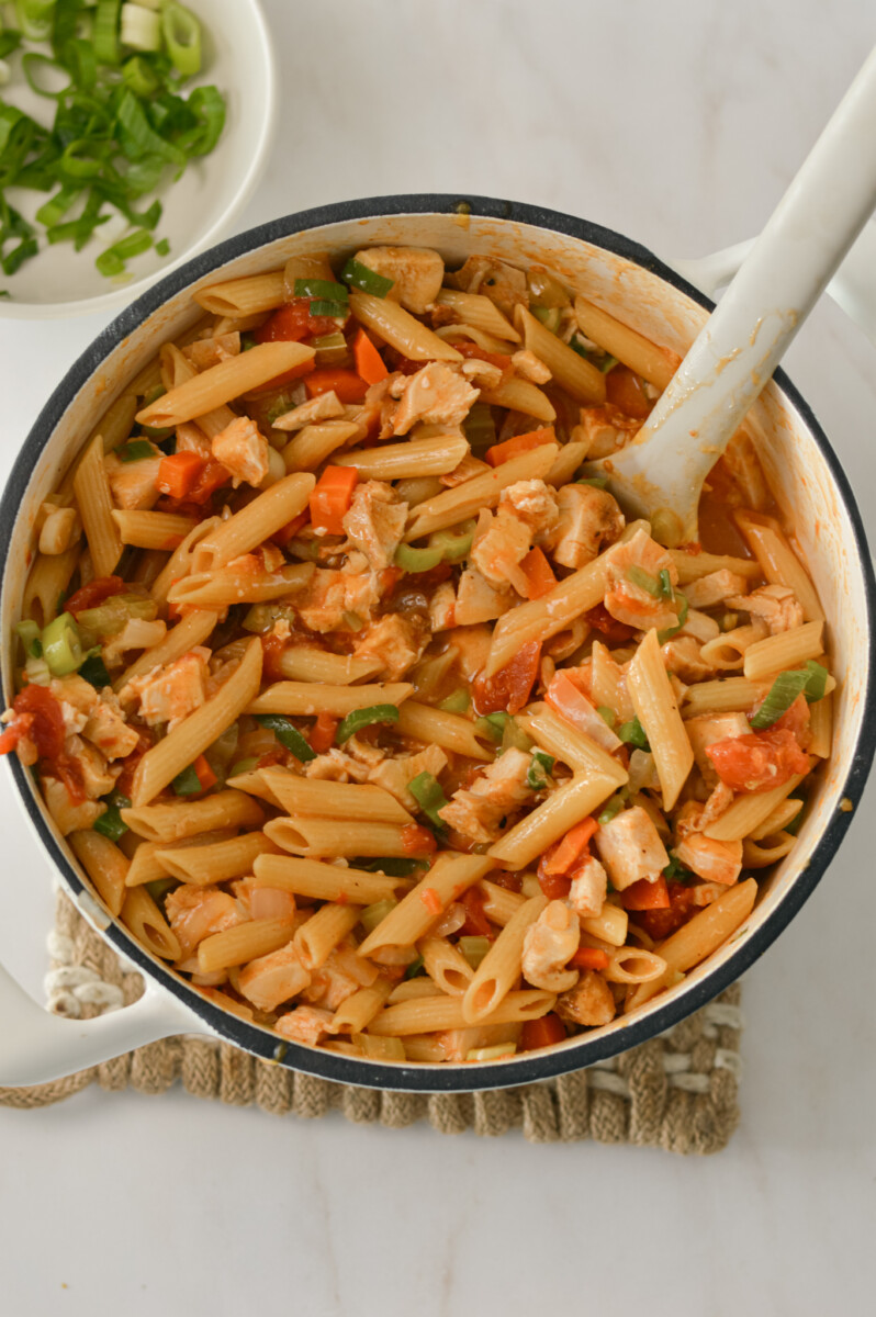 Buffalo sauce and chicken added to the pot.