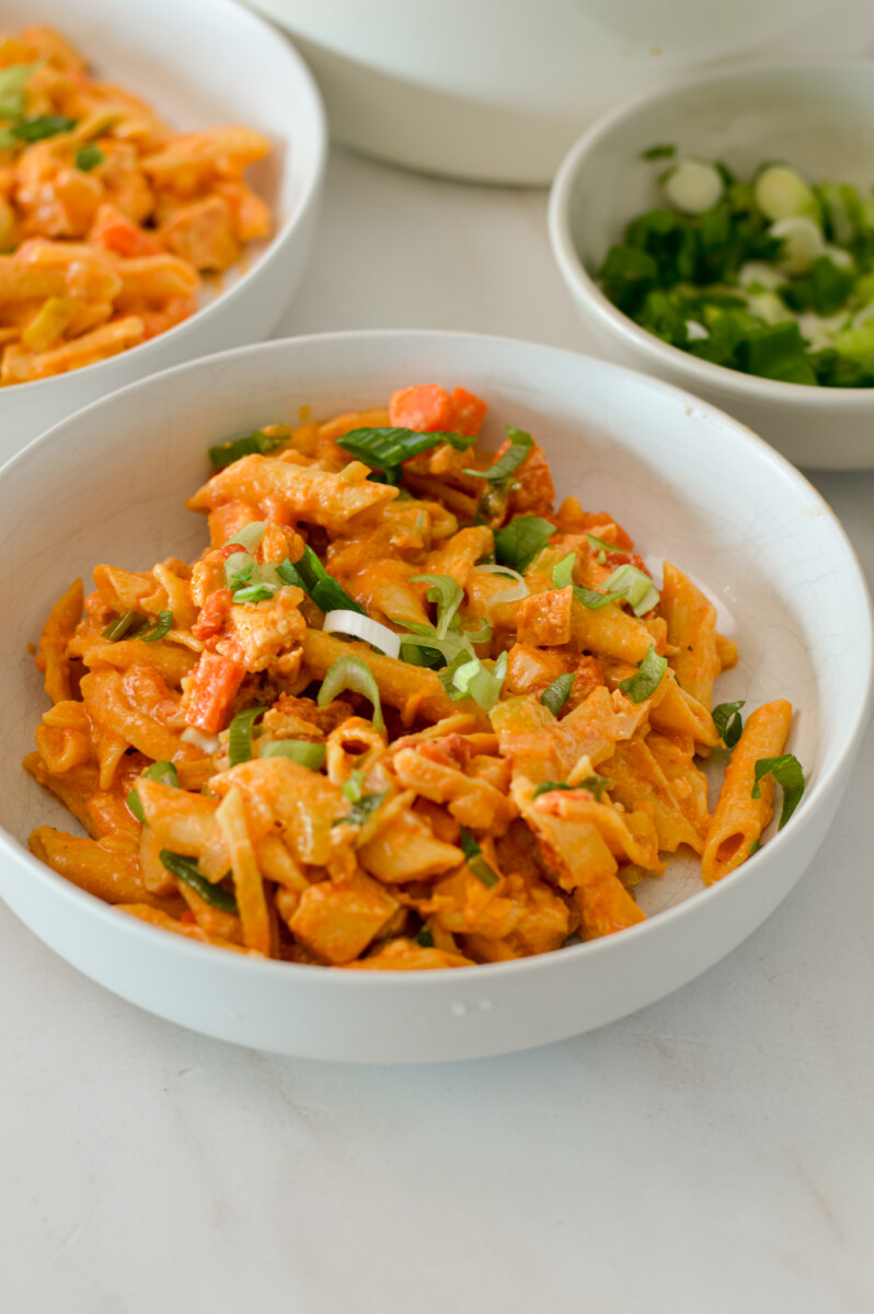 One pot buffalo chicken pasta added to a bowl.