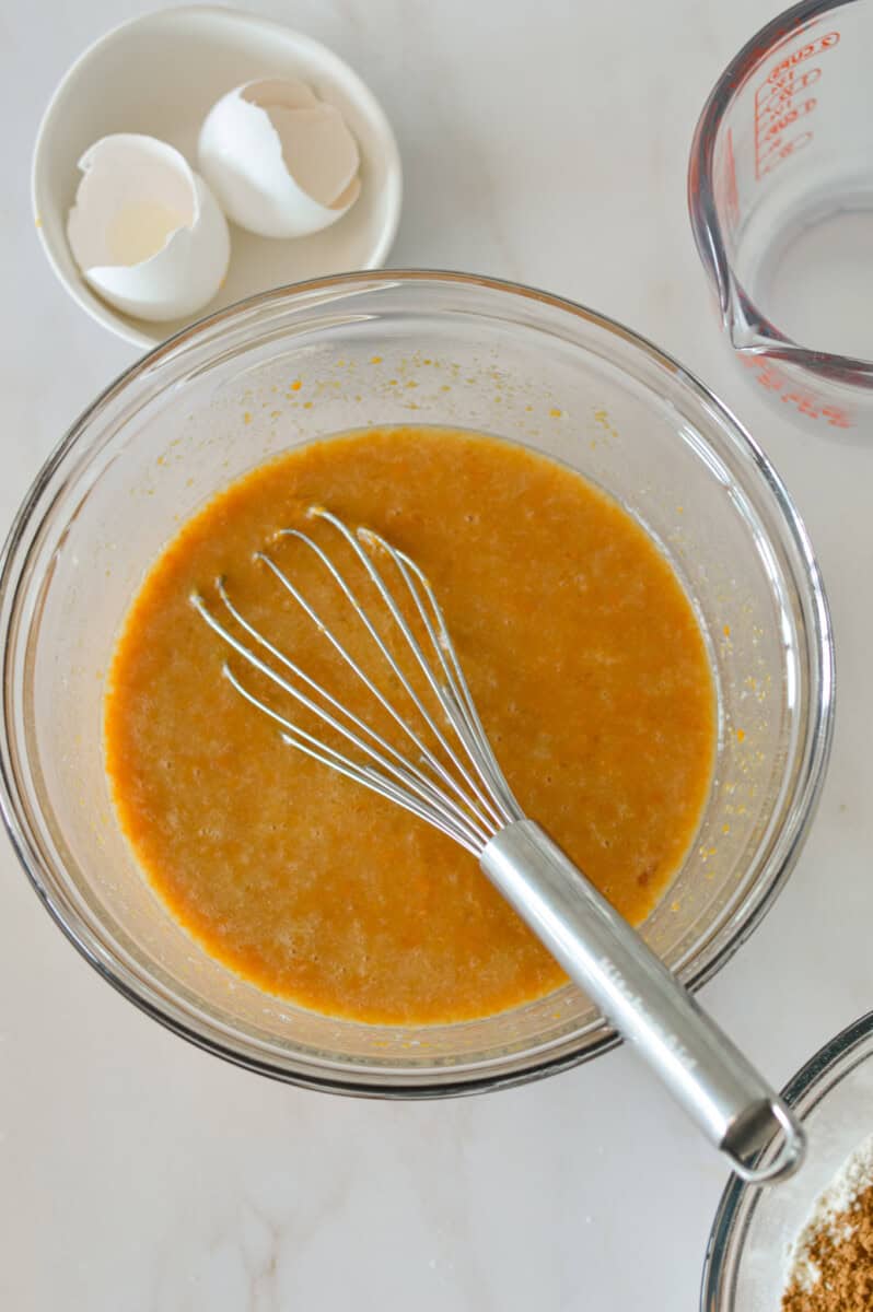 Wet ingredients combined in a mixing bowl.
