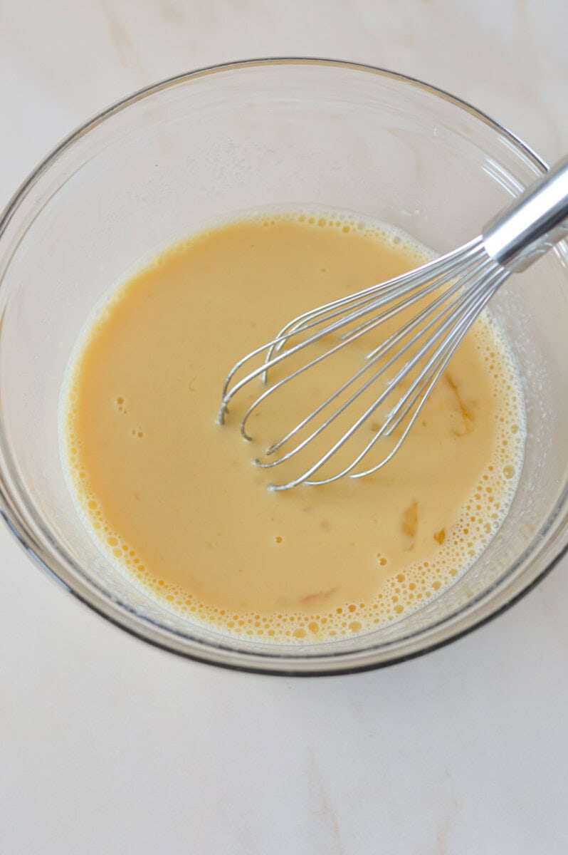 Wet ingredients combined in a mixing bowl.